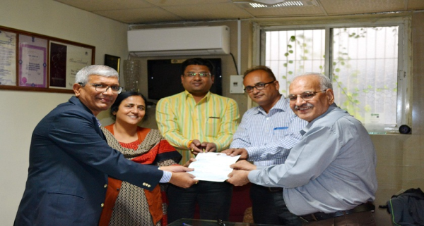 Handing over of cheque of Rs. 16,61,000 to Blind People